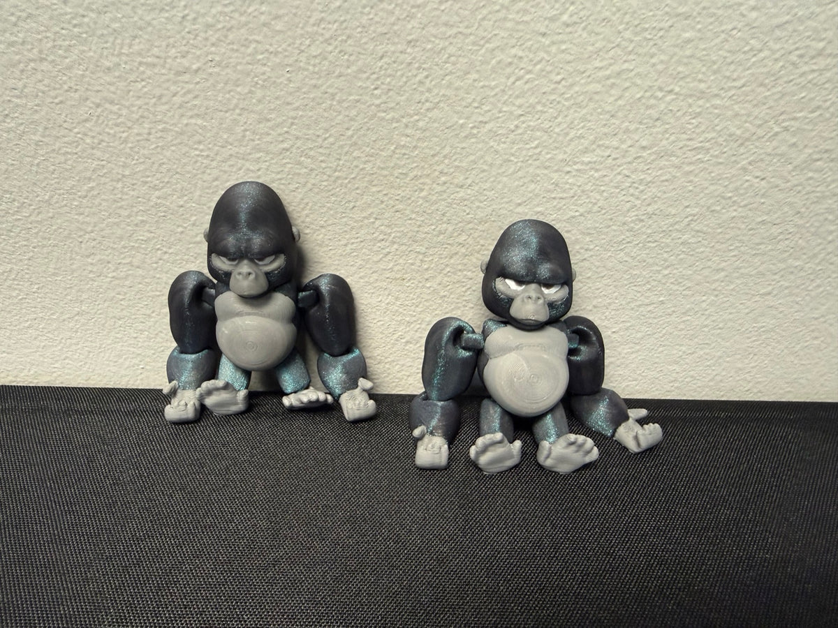 Articulated gorilla figures seated