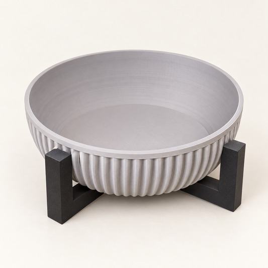 Light gray ribbed Alder bowl on a dark geometric stand