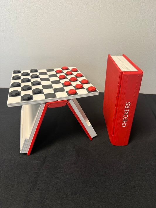 Black and red checkers on the raised book-style board beside the red book case