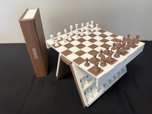 Book-style chess board opened on its raised stand beside the brown book case