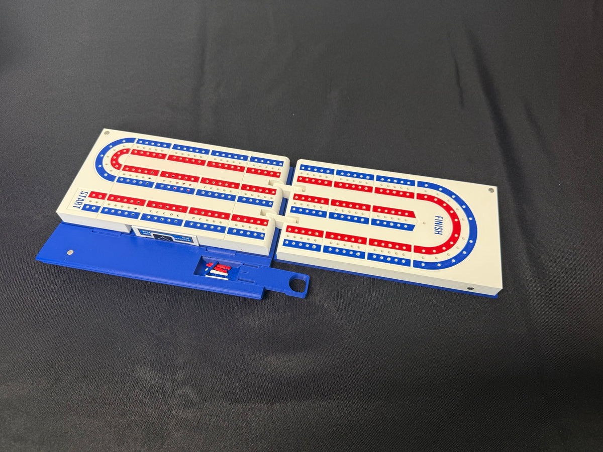 Open cribbage board with book-shaped storage base