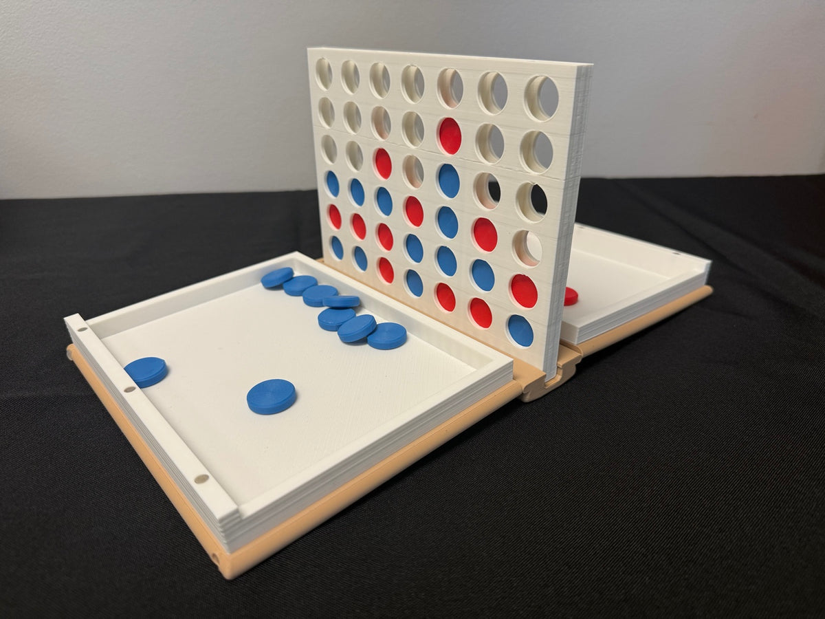 Open four-in-a-row game with blue and red discs