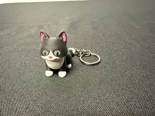 Black and white articulated cat keychain