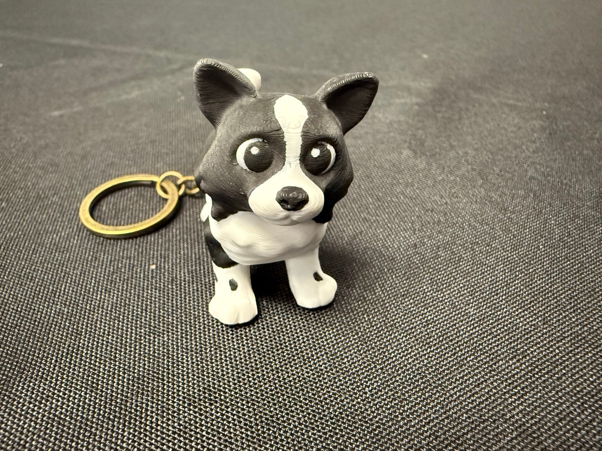 Black and white articulated border collie keychain