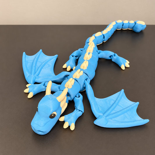 Blue and cream articulated winged dragon