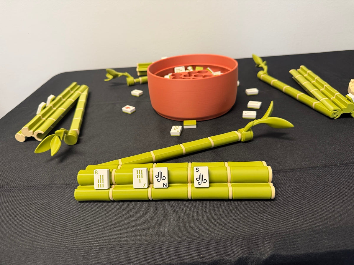 Bamboo mahjong set opened with tile racks and storage