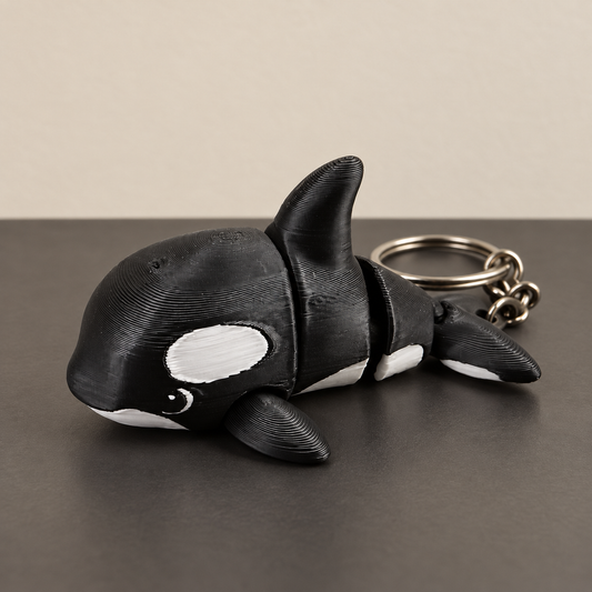 Black and white articulated orca keychain