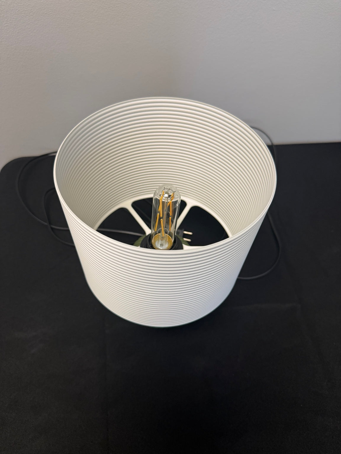 Top view of the ribbed table lamp showing the bulb and shade