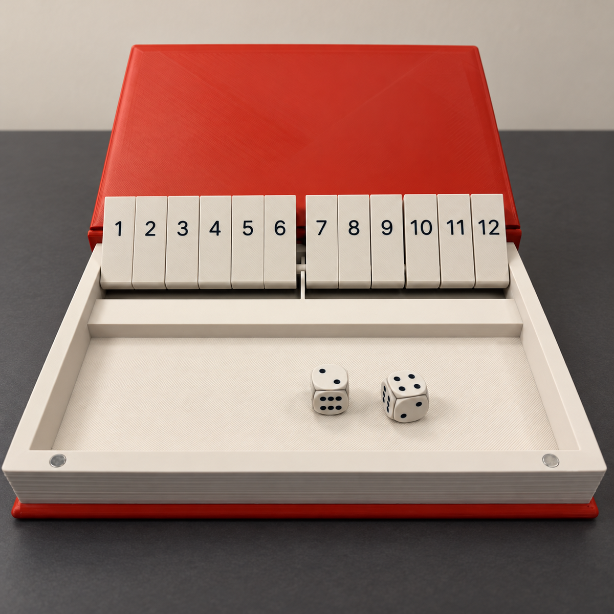 Open red and cream Shut the Box game with numbered tiles and dice