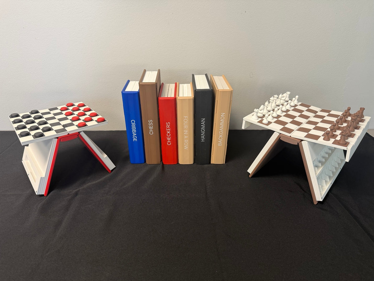 Book-style games standing together between open chess and checkers boards